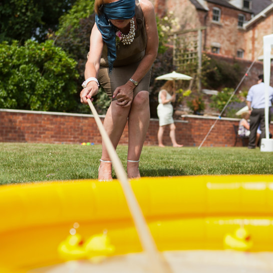 Trying to catch those rubber ducks in a paddling pool. Fun and Games at a wedding.