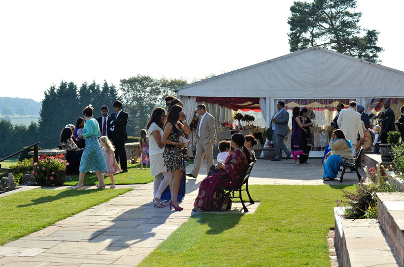 The marquee entrance sits neatly in the landscaped gardens.