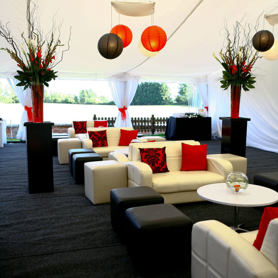 A red, white and black bar area customised into a marquee by Finesse Planning.