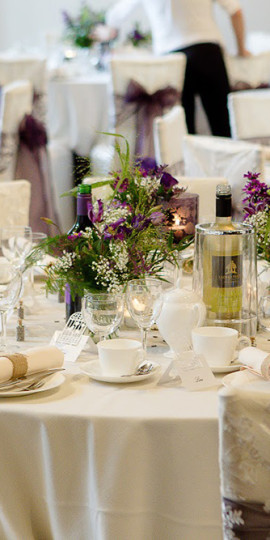 A rich purple set up at a wedding breakfast at Burton Court.